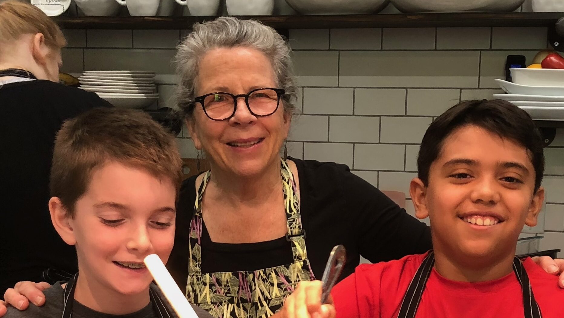 Anne with two campers in the Shaver's Creek kitchen.