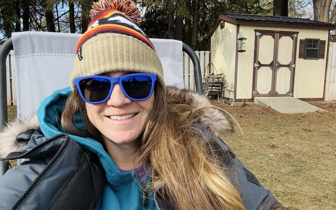 Keely Deutsch wearing a hat and sunglasses