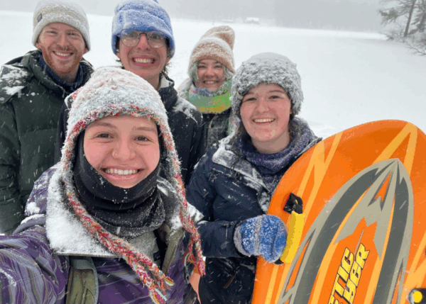 A group of interns on a sledding trip.