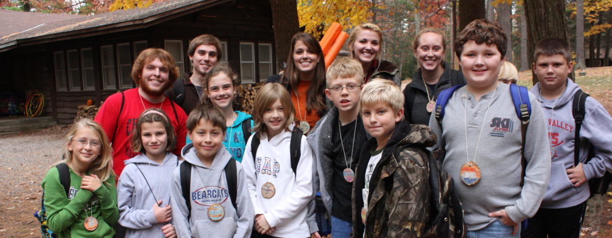Group of happy Outdoor School campers and their counselors