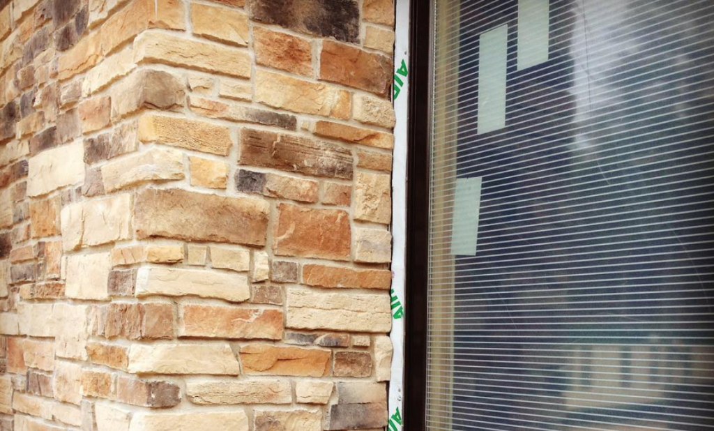 Closeup view of bird friendly glass that shows the horizontal line pattern, designed to reduce bird collisions with the glass