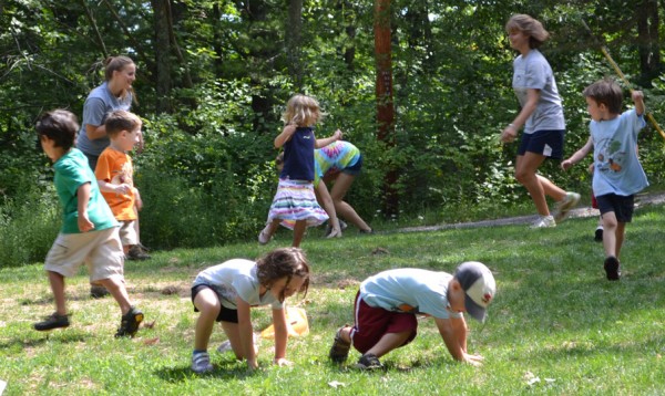 Kids and counselors playing a running game.