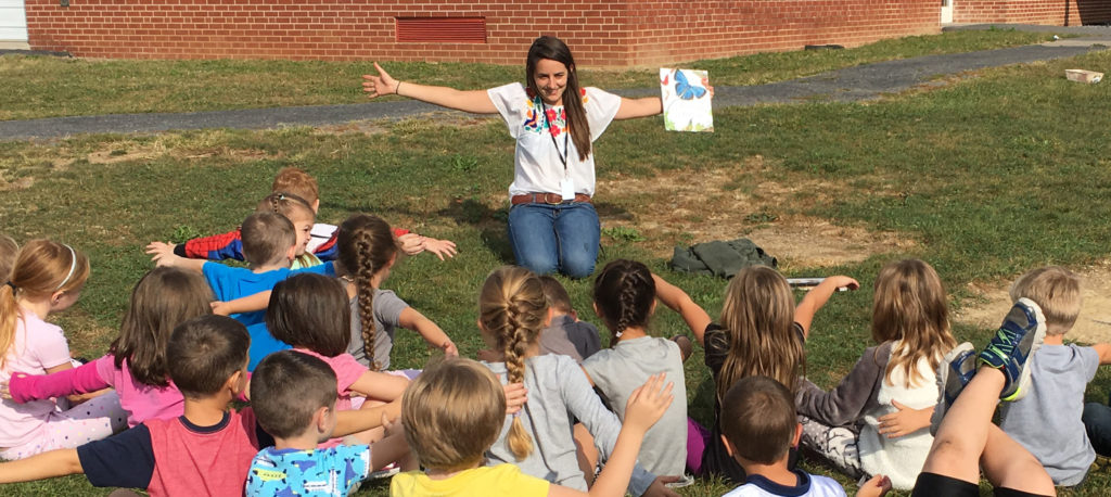 Camp counselor with a group of kids