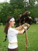 Woman holding golden eagle