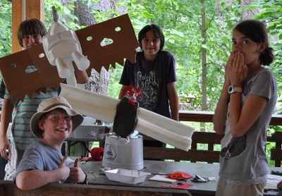 Raptor campers display their final bird of prey sculptures.