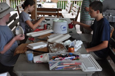 Raptor campers create bird of prey sculptures out of recycled materials.