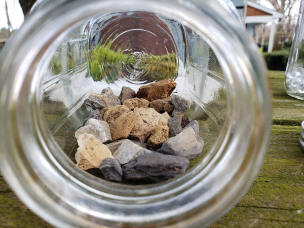 Small rocks in a Mason jar