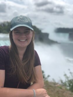 Leah standing next to waterfall
