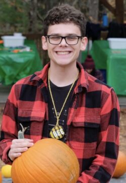 Kyle holding a pumpkin
