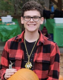 Kyle holding a pumpkin