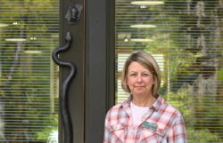 Patti Gray standing at the front door of the Shaver's Creek visitor center