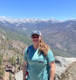 Natalia Reed with a mountain view behind her