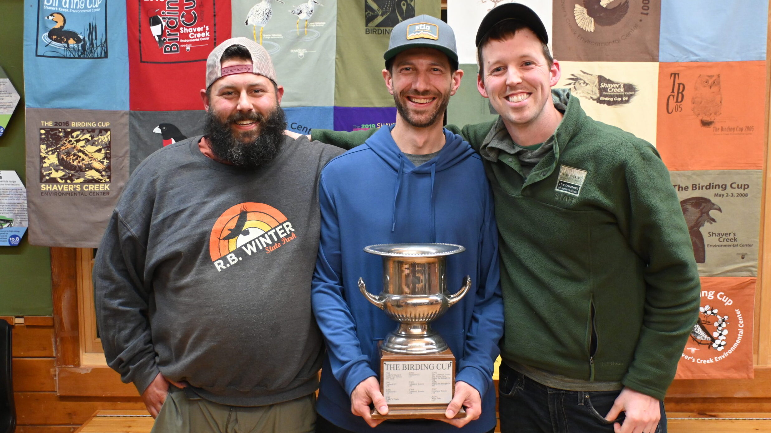 Winners of the Birding Cup, Raiders of the Lost Lark, holding their trophy