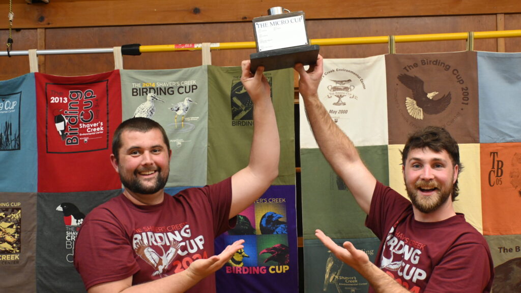 Members of The Rebel Bird Club holding the Micro Cup.