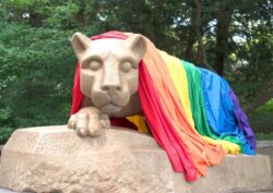 The Nittany Lion Shrine draped in a pride flag