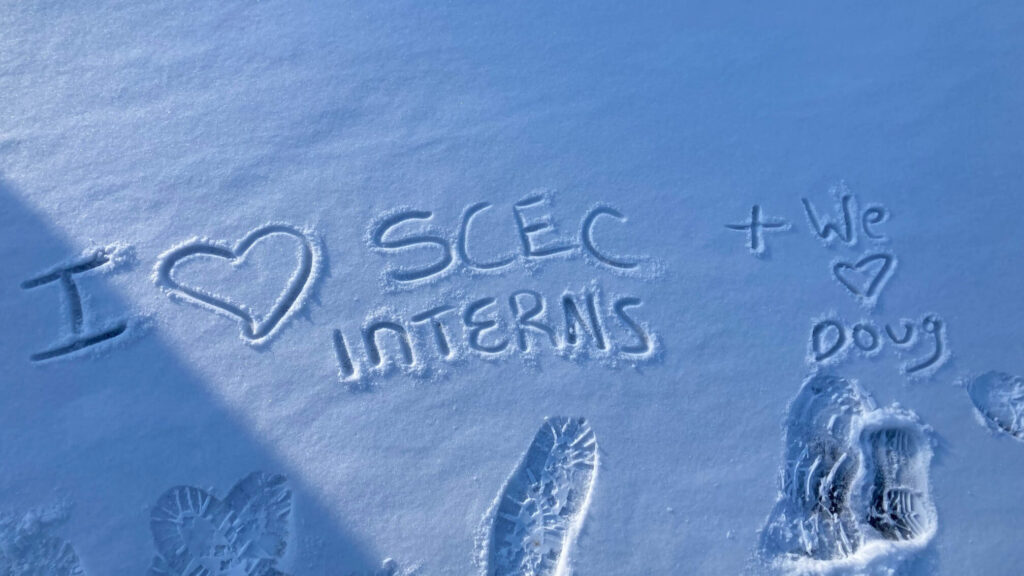 The words, "I love Shaver's Creek interns" and "We love Doug" are written in the snow