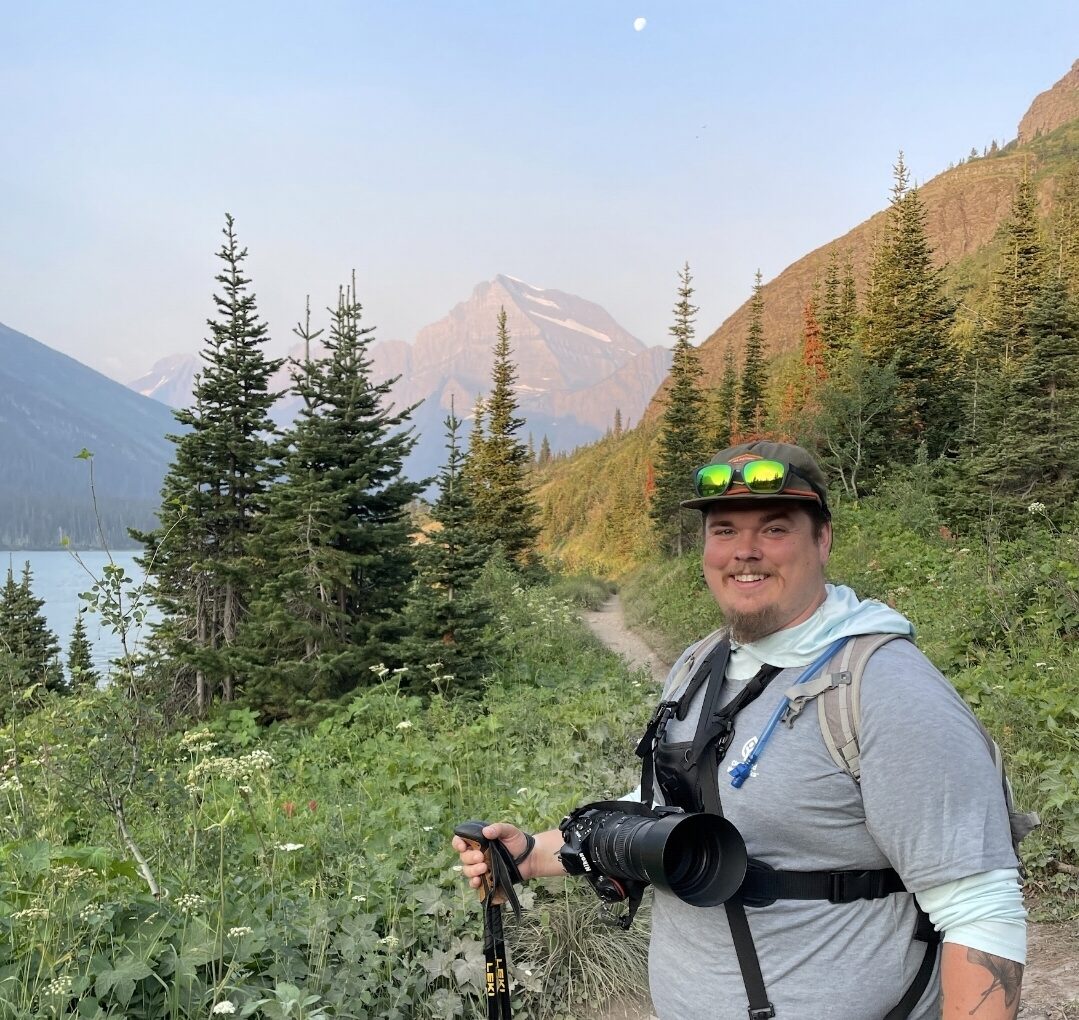 Kyler hiking in the mountains.