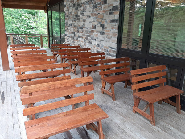 Hamer Deck set up with Wooden Benches in rows, all facing one direction.