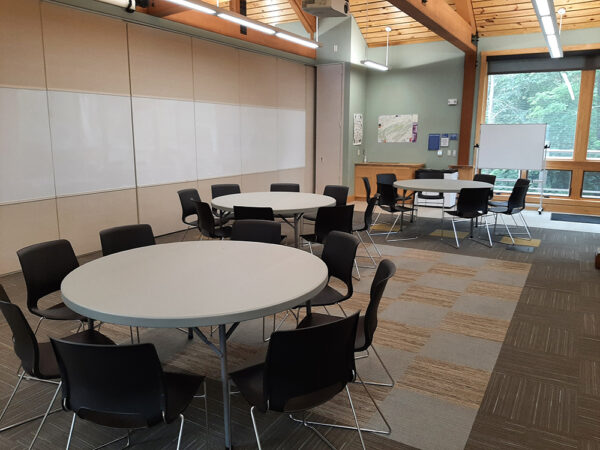 Hamer Lakeside Classroom set up with 5-foot-diameter tables with chairs around each table.
