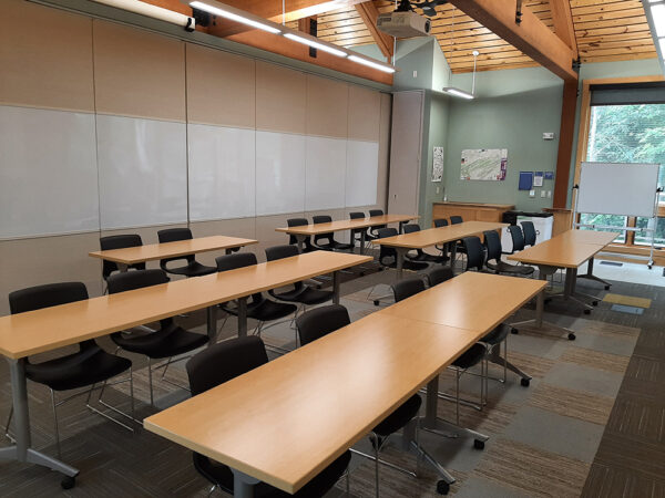 Hamer Lakeside Classroom set up with long tables in rows and all chairs facing the front of the classroom.