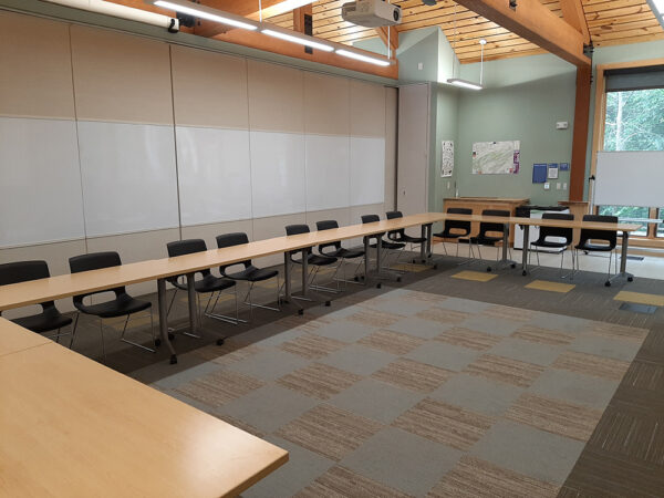 Hamer Lakeside Classroom set up with long tables in a U shape and chairs on the outside of the U.
