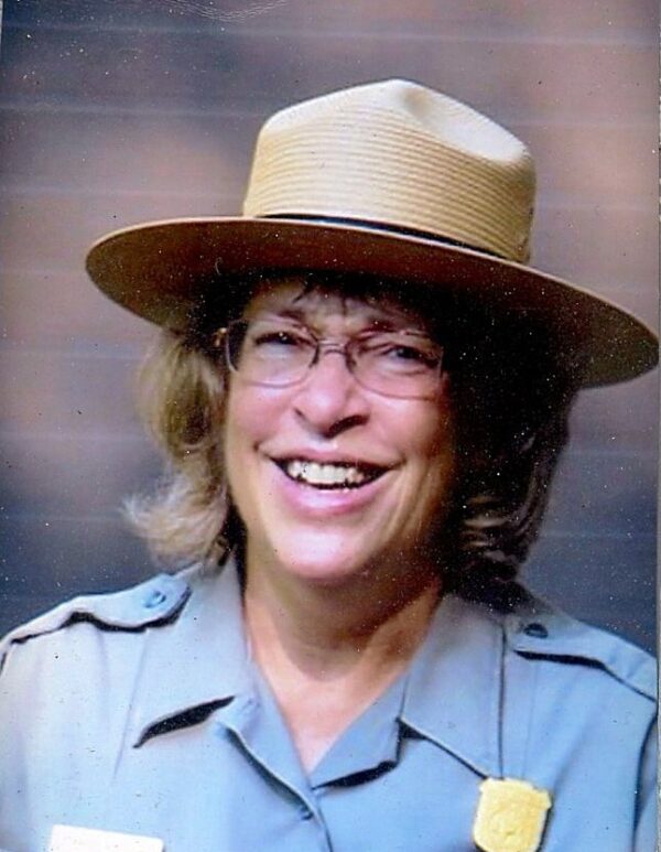 Mara wearing a National Park Service uniform and the classic brimmed ranger hat.