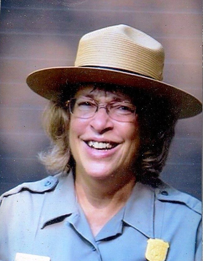 Mara wearing a National Park Service uniform and the classic brimmed ranger hat.